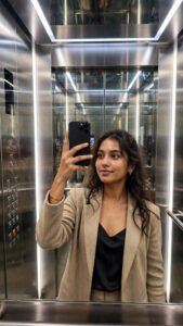 Glamorous woman elevator mirror selfie portrait